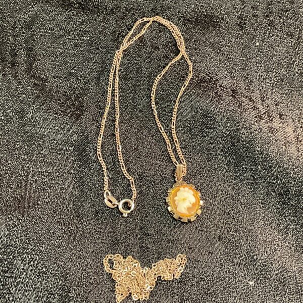 Vintage 925 silver cameo necklace with floral design.