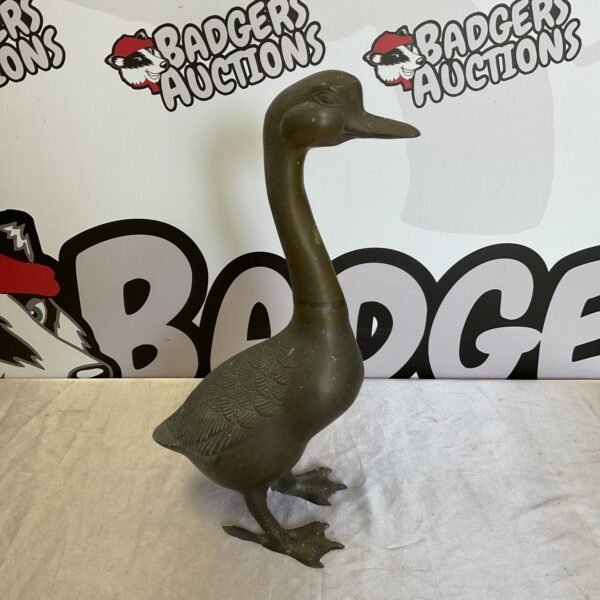 Vintage brass duck statue, detailed metal figurine for home decor.