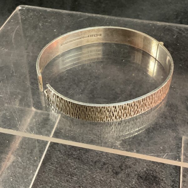 Hallmarked silver hinged bracelet, classic vintage jewellery.