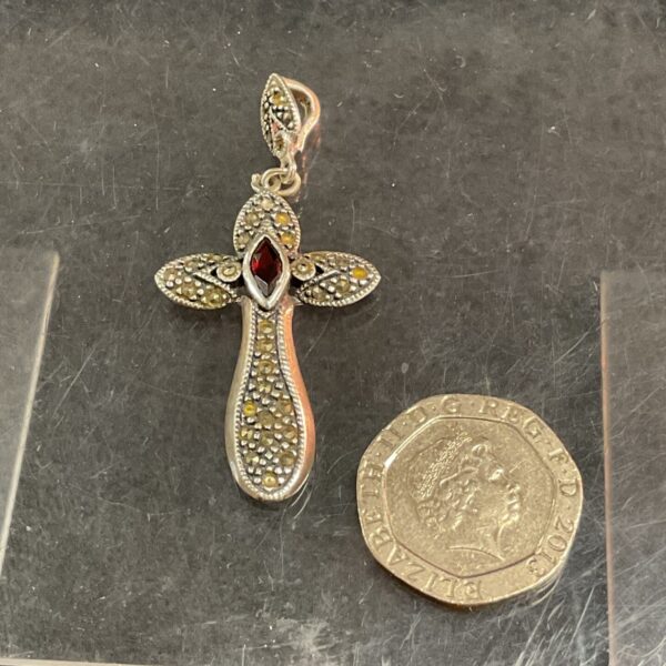 Vintage art nouveau marcasite and garnet cross pendant in silver.
