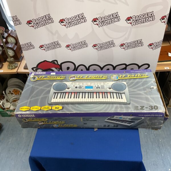 Yamaha EZ-30 keyboard, a portable electronic musical instrument.