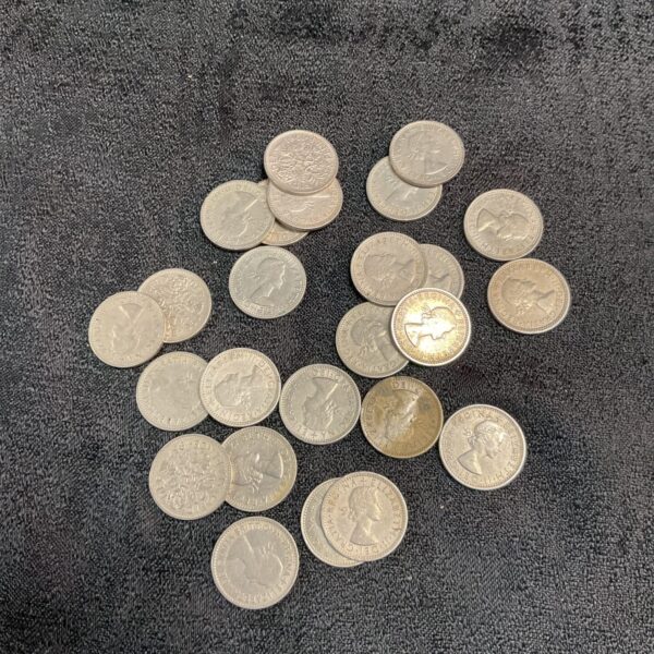 A lot of silver British sixpence coins for collectors.