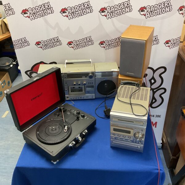 Vintage hi-fi system with record player and Kenwood stereo components.