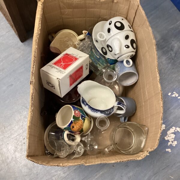Mixed kitchenware lot with jugs, glasses, and ceramic pieces.