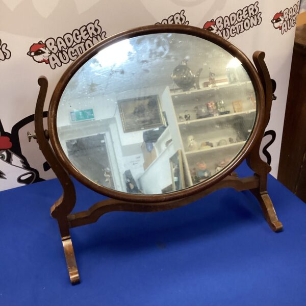 Vintage mahogany dressing table mirror with oval shape.