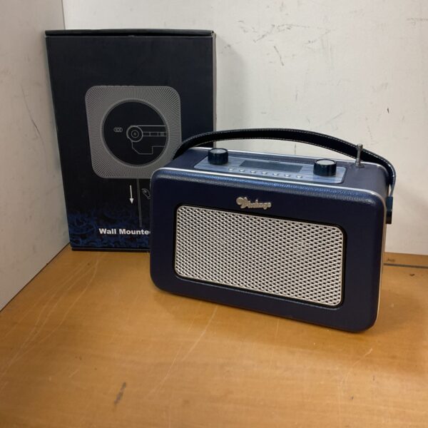 Vintage Zennox radio mounted on a wall, retro audio equipment.