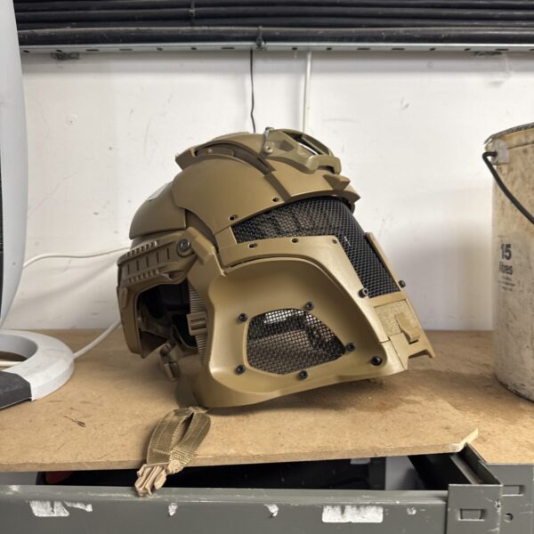 Tactical airsoft helmet with protective visor for gameplay.