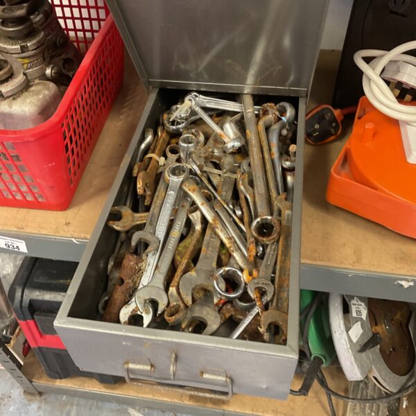 Tin full of used spanners and wrenches for mechanics.