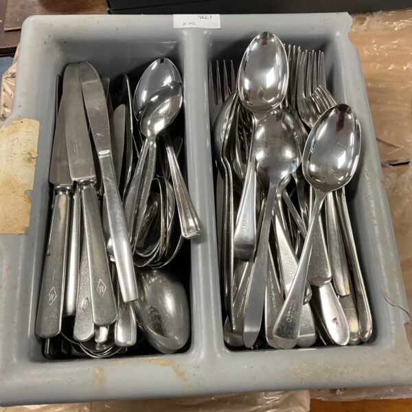 Stainless steel cutlery set including Woolco and SSP pieces.