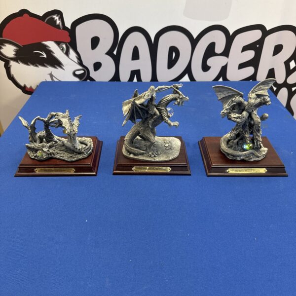 Three pewter dragon figures from Might & Magic series.