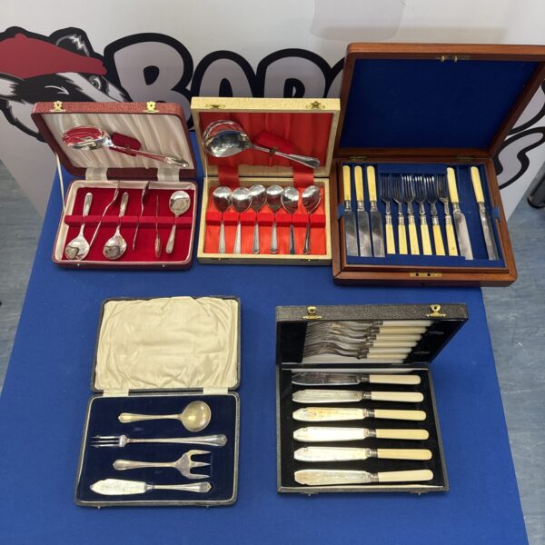 Vintage silver plated cutlery sets in presentation cases.