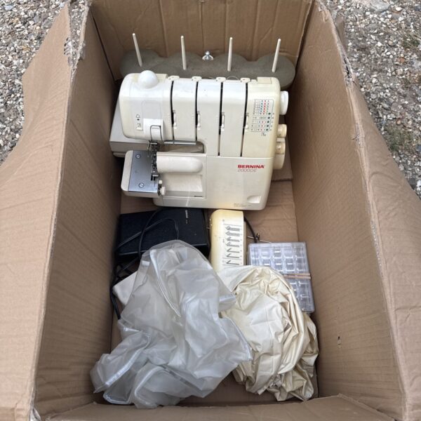 Bernina 2000de overlocker sewing machine in a cardboard box.