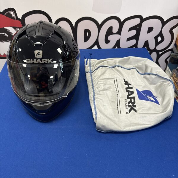 Sleek black Shark full-face motorcycle helmet in excellent condition.