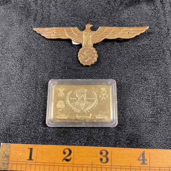 WWII German eagle badge with swastika, detailed military insignia.