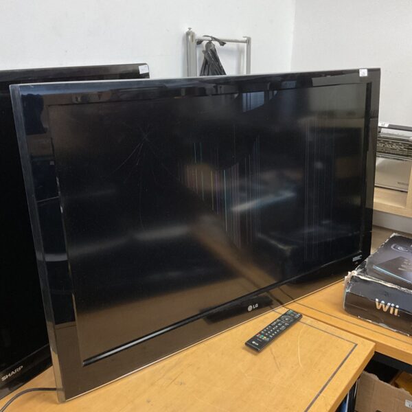 LG 50" HD TV with a cracked screen and remote control.