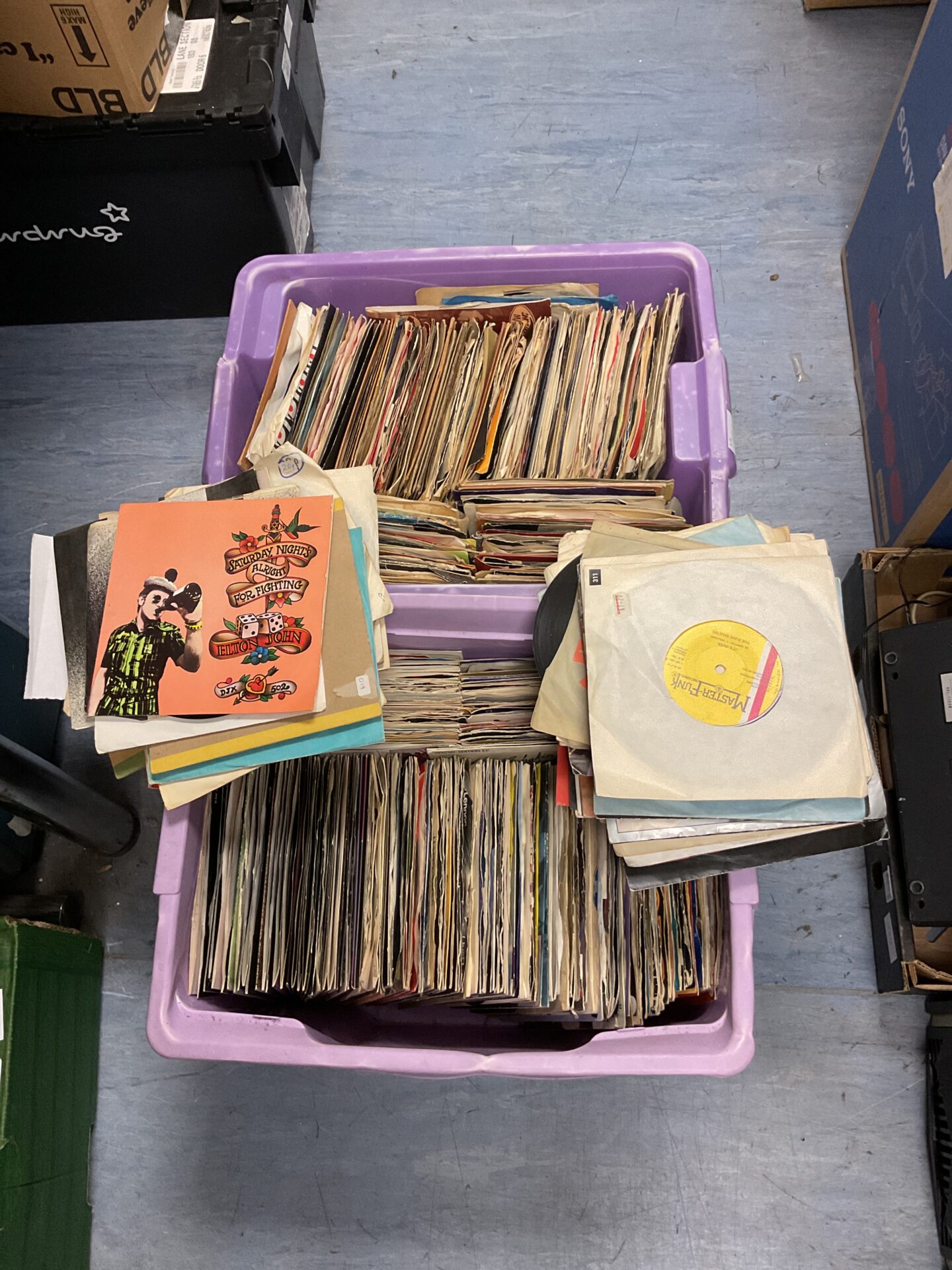 100 Two boxes of 7” single vinyl records inc rock