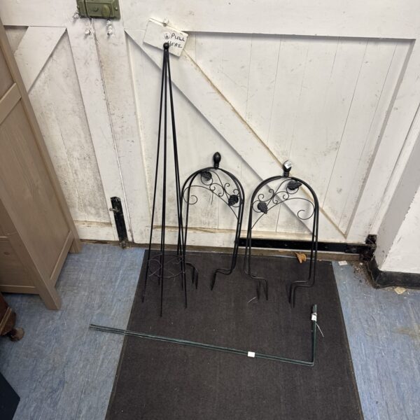 Set of three metal plant growing runners for garden support.