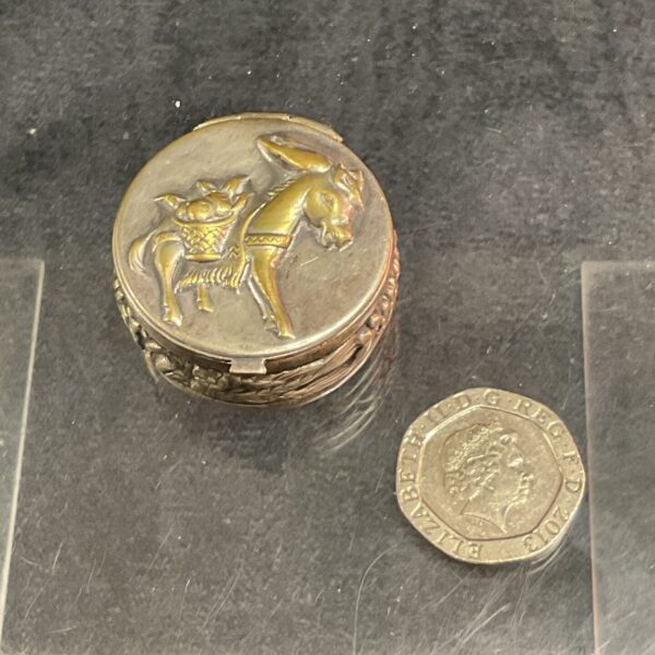 Antique Continental silver pill box with donkey decoration.