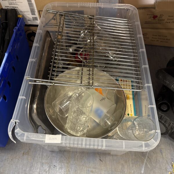 Large plastic box filled with mixed kitchen items and a cooling rack.