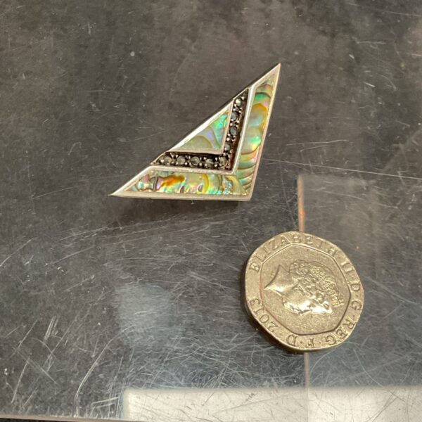 Vintage silver Art Deco brooch with iridescent abalone inlay.