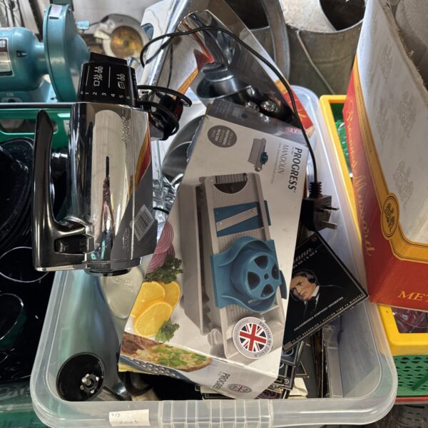 Vintage Mixmaster kitchen mixer and accessories in a plastic box.