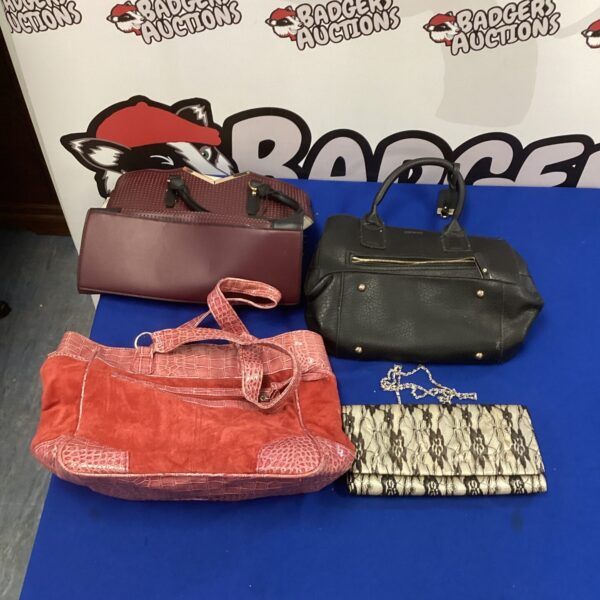 Selection of ladies handbags and purses in a lot.