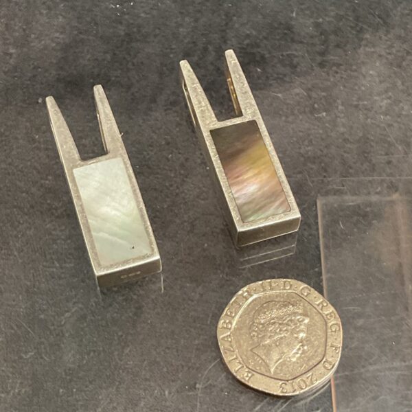 Pair of hallmarked silver pendants with mother of pearl and abalone inlay.