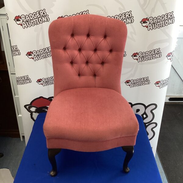 Vintage rose pink padded nursery chair with turned legs.