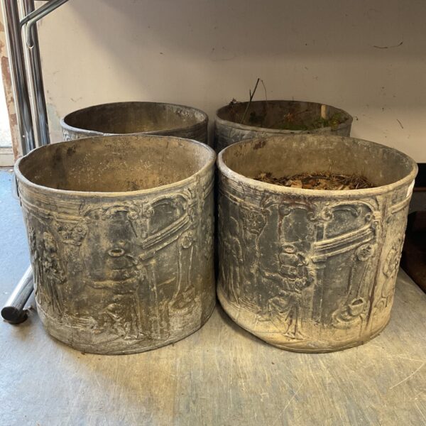 Set of four antique Victorian lead tavern planters for garden display.