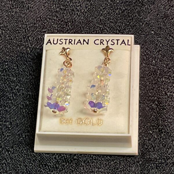 Sparkling 9ct gold Austrian crystal drop earrings on display.