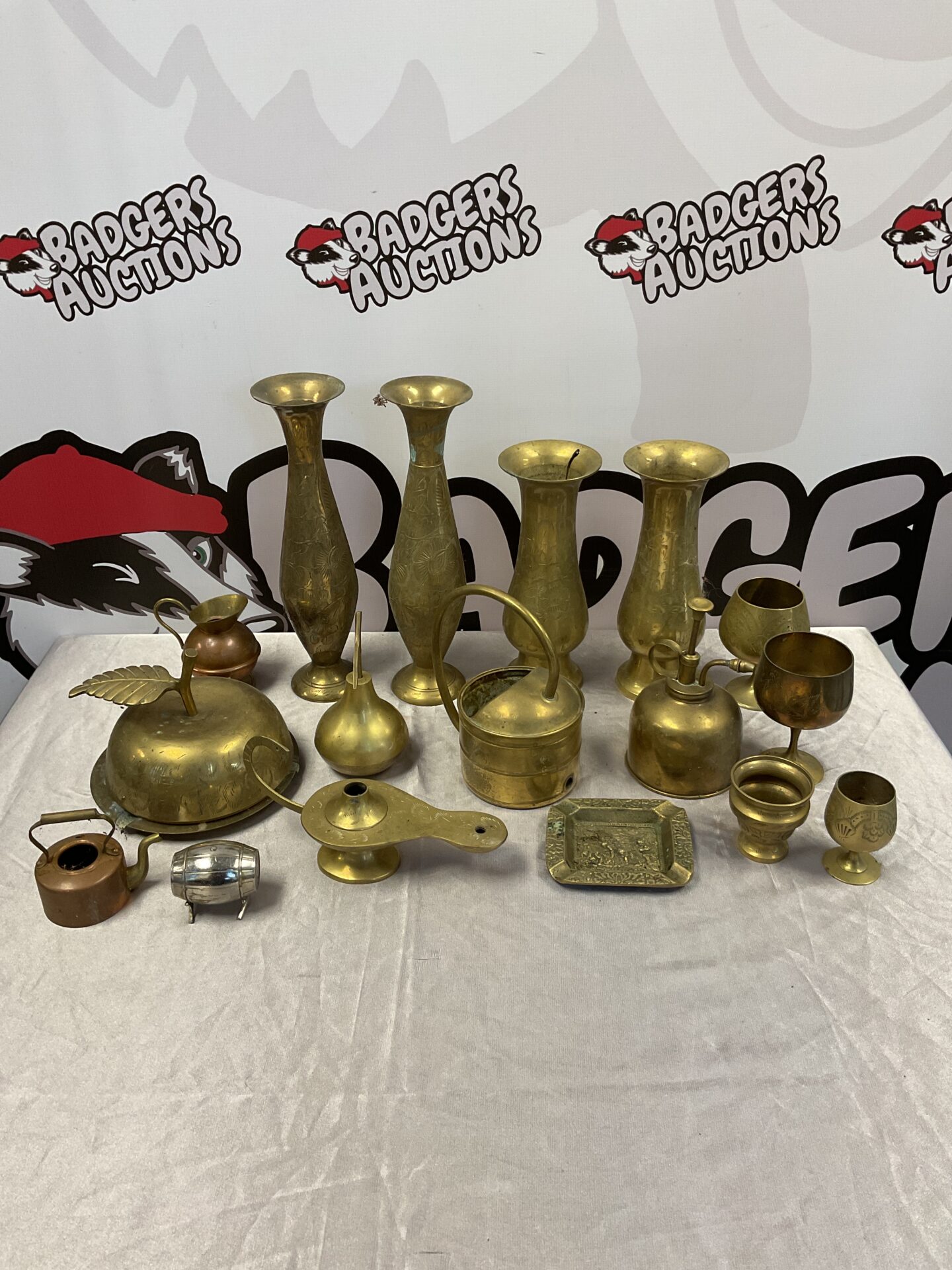 064 Box of mixed brassware including vases