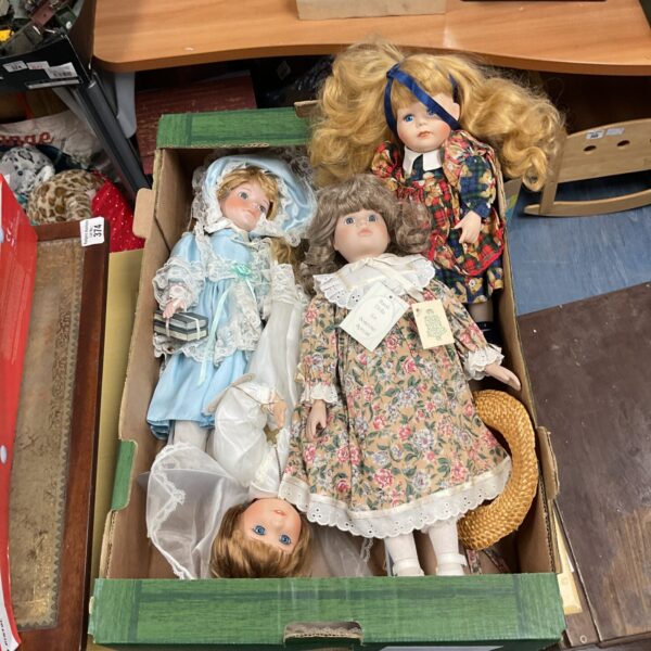 Lot of four vintage porcelain dolls, collectible figurines.