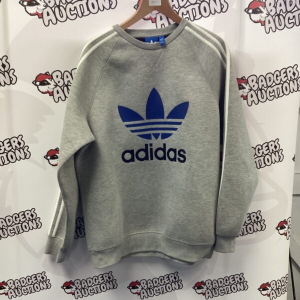 Vintage Adidas sweatshirt with trefoil logo, classic sportswear.
