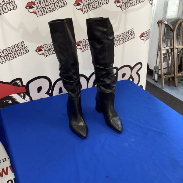 Black ladies leather ankle boots, stylish fashion footwear.