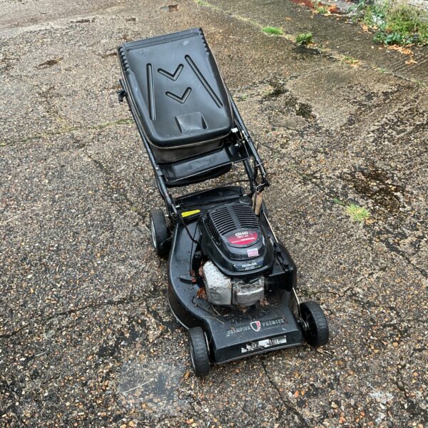 Vintage Champion Premier lawn mower for garden maintenance.
