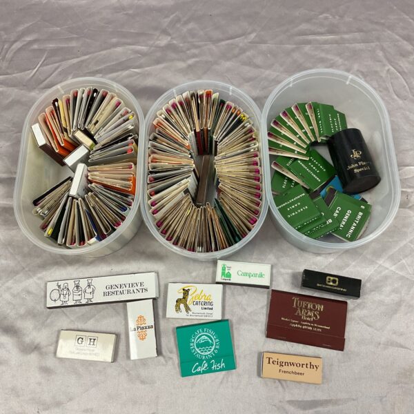 Large collection of vintage matchbooks, advertising various establishments.