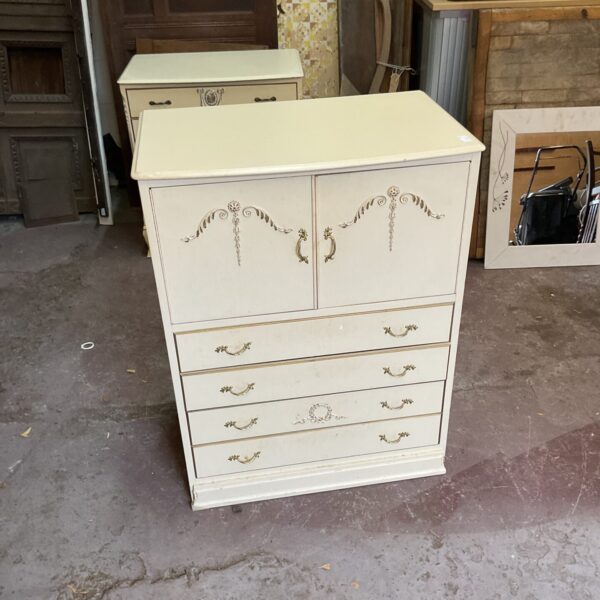Antique four-drawer wooden dresser with cupboard doors.