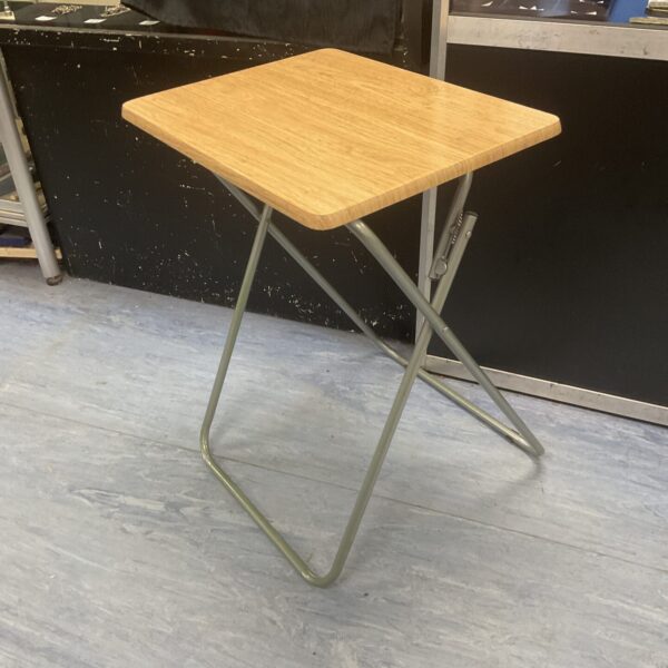 Small folding table with wood-effect top and metal frame.