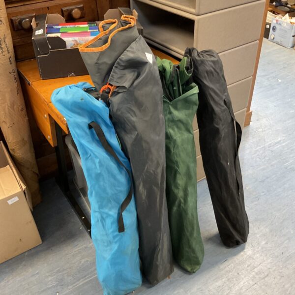 Lot of four colourful folding camping chairs for outdoor use.