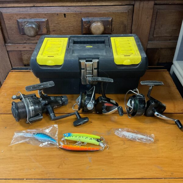 Vintage fishing reel and lure lot with Daiwa and Intrepid brands.