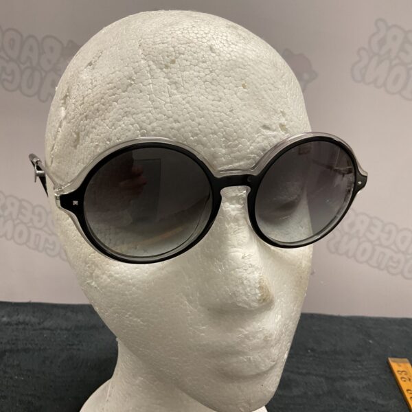Front view of vintage Valentino sunglasses with dark frames.