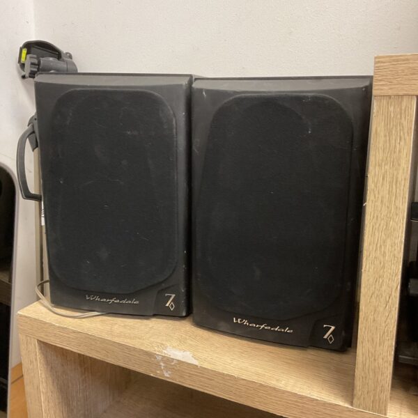 Pair of vintage Wharfedale Diamond 7 bookshelf speakers in a home setting.