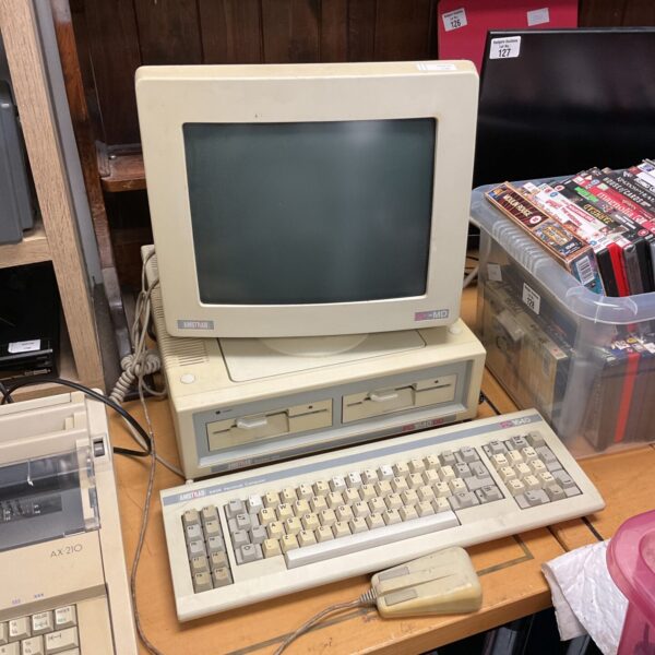 Vintage Amstrad PC 1640 computer with keyboard and mouse.