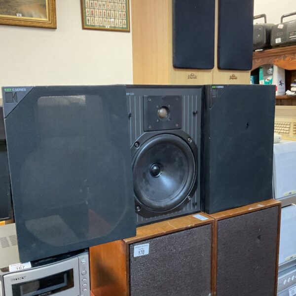 Pair of vintage Kef C20 bookshelf speakers in a home setting.