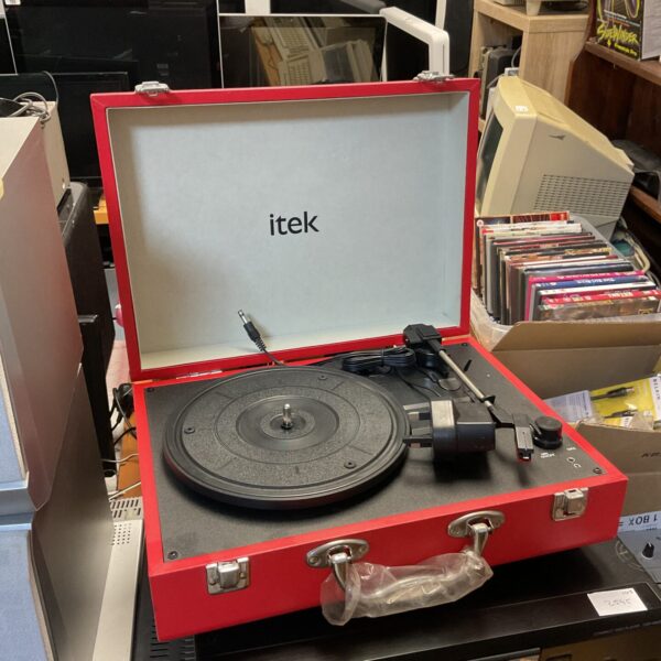 Red itek portable record player, vintage vinyl turntable for music lovers.