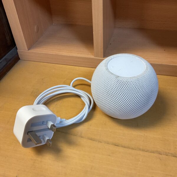 Apple HomePod smart speaker with power cable shown.