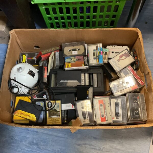 Large lot of vintage cassette tapes for music collectors and retro audio enthusiasts.