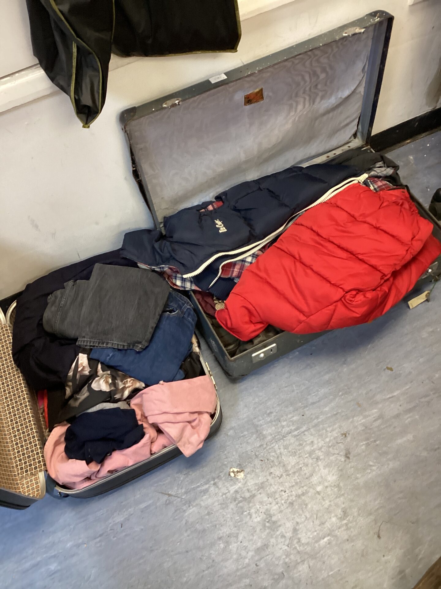 555 Two suitcases of mixed clothing inc lee cooper gilet