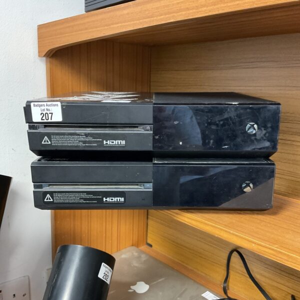 Pair of Microsoft Xbox One gaming consoles for sale.