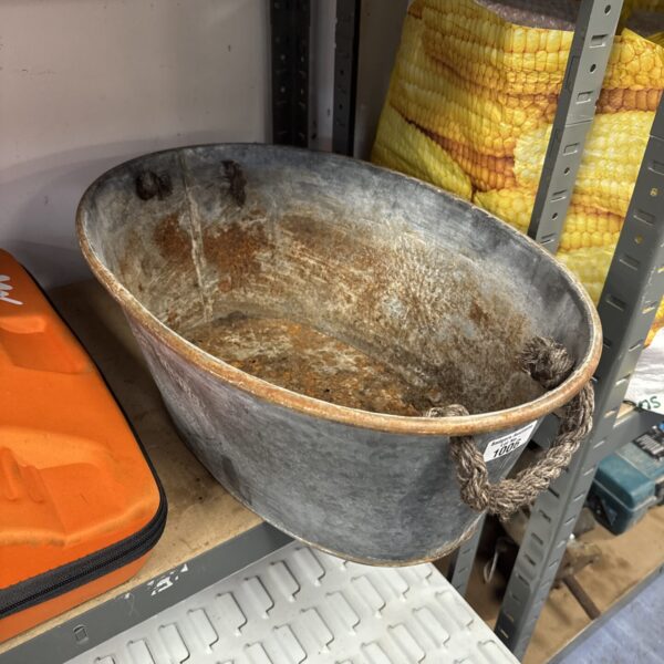 Large vintage Covent Garden galvanised planter on a shelf.